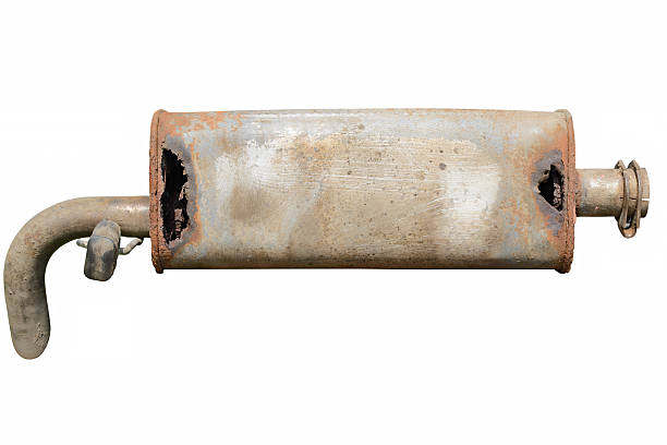 An old and rusty Toyota forklift muffler with multiple cracks and holes